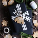 beautiful holiday gift wrapping ideas with black paper and gingerbread cookies